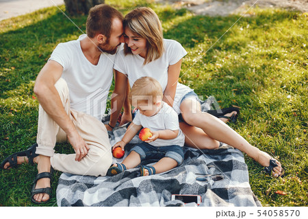 Family with son playing in a summer park 54058570