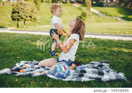 Mother with son playing in a summer park 54058695