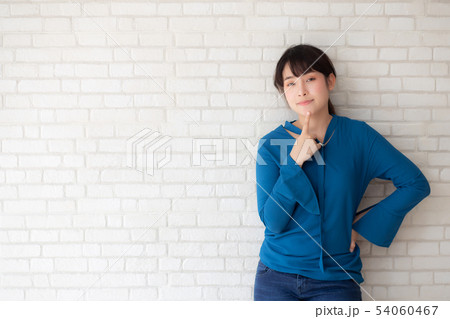 Beautiful portrait young asian woman confident 54060467