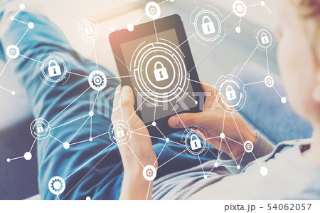 Cyber security theme with man using a tablet Cyber security theme with man using a tablet 54062057