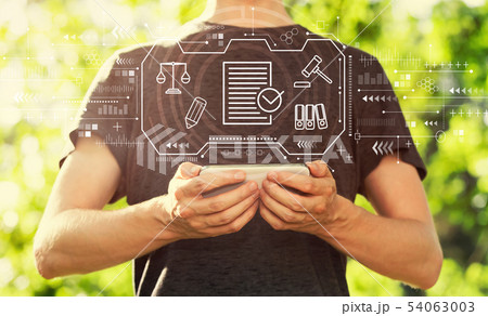 Compliance theme with man holding his smartphone 54063003