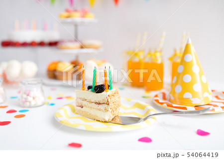 piece of cake on plate at birthday party piece of cake on plate at birthday party 54064419