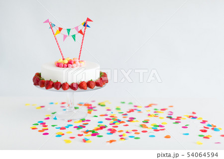 close up of birthday cake with garland on stand close up of birthday cake with garland on stand 54064594