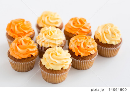 cupcakes with frosting on white background cupcakes with frosting on white background 54064600