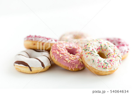 close up of glazed donuts on white table 54064634