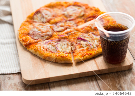 close up of homemade pizza with cola on table close up of homemade pizza with cola on table 54064642
