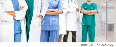 Doctor working in hospital with other doctors. Doctor working in hospital with other doctors. 54065735