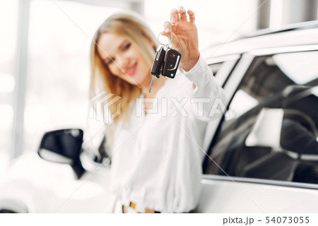 Stylish and elegant woman in a car salon Stylish and elegant woman in a car salon 54073055