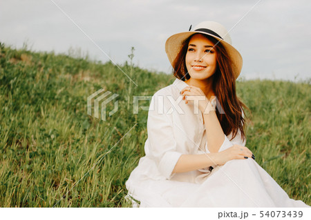 Charming long hair asian girl in white dress 54073439