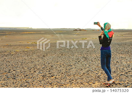 Young woman takes a selfie on her smartphone on Young woman takes a selfie on her smartphone on 54075320