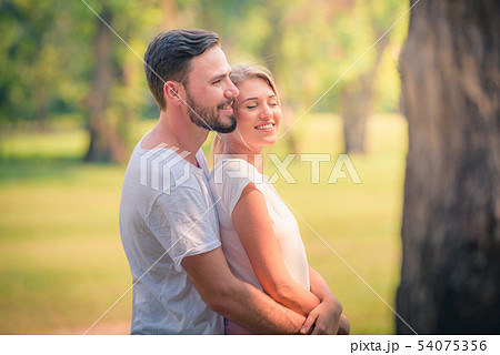 Portrait of Young couple enjoying in the park at s 54075356