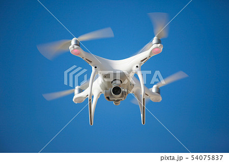 The drone hovered a blue sky background 54075837