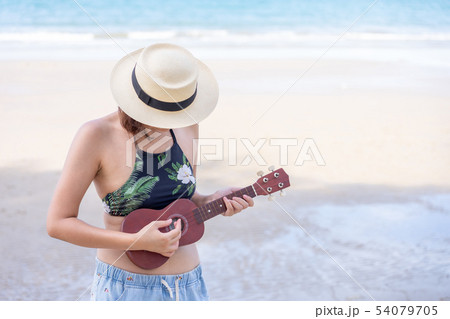 Young Asian woman wear swimsuit  playing on the 54079705