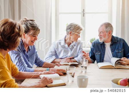 Senior people in bible reading group in community center club. Senior people in bible reading group in community center club. 54082015