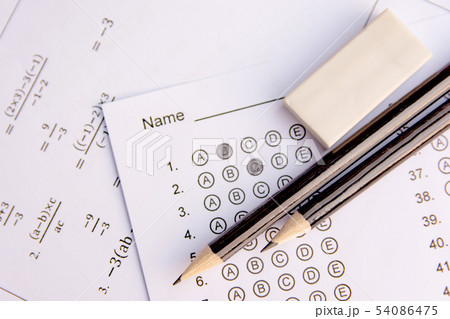 Pencil and eraser on answer sheets or Standardized 54086475