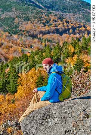 Backpacker man at Artist's Bluff in autumn Backpacker man at Artist's Bluff in autumn 54087735