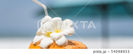 Fresh young orange coconut with a tube for drinks Fresh young orange coconut with a tube for drinks 54098933
