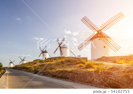 Windmills at sunset in Consuegra, Castile-La Mancha, Spain. 54102755
