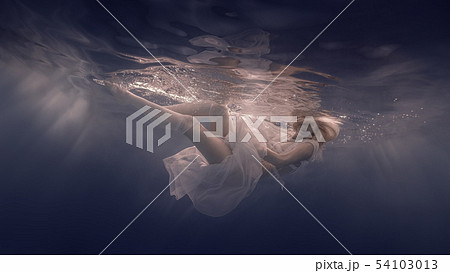 Woman in a white dress under water 54103013