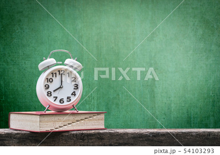 Back to school concept with clock and book Back to school concept with clock and book 54103293