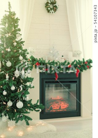 Fireplace decorated for Christmas holidays 54107343