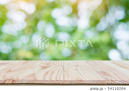 Empty wood table top and blur nature background Empty wood table top and blur nature background 54110204