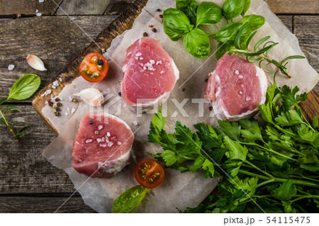 Raw filet mignon meat cuts with spice and herbs 54115475