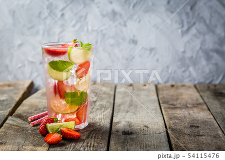 Strawberry mojito on rustic wood background Strawberry mojito on rustic wood background 54115476