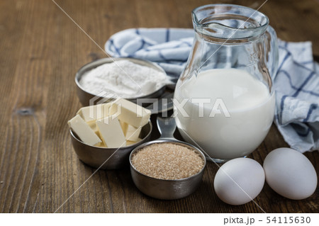 Baking ingredients in measuring cups Baking ingredients in measuring cups 54115630