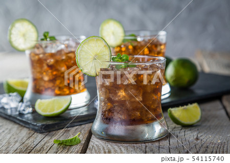 Rum and cola cocktail in glasses Rum and cola cocktail in glasses 54115740