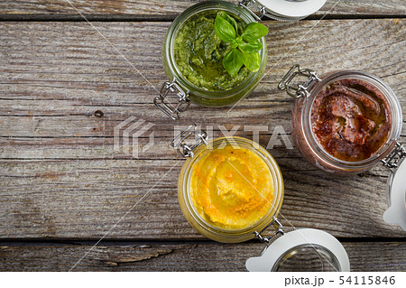 Selection of colorful hummus in jars Selection of colorful hummus in jars 54115846