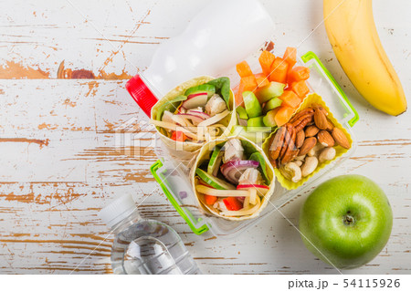 Lunch to go with tortilla wraps and vegetables 54115926