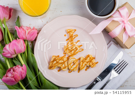 Mother's day breakfast concept - pancakes, coffee, flowers, present 54115955