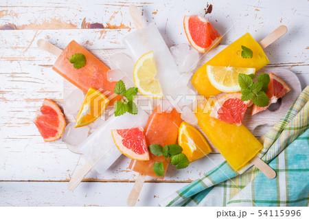 Colorful popsicles on rustic wood background 54115996