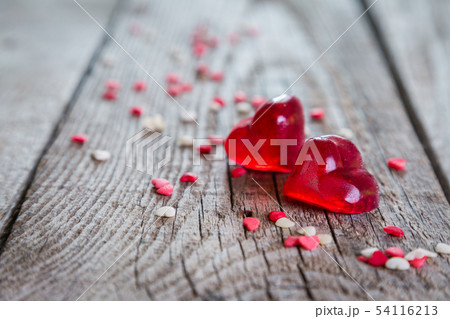 Valentine's day concept - heart shaped sweets on rustic background Valentine's day concept - heart shaped sweets on rustic background 54116213