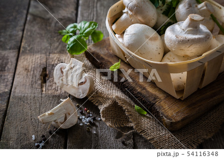 Mushrooms on rustic wood background Mushrooms on rustic wood background 54116348
