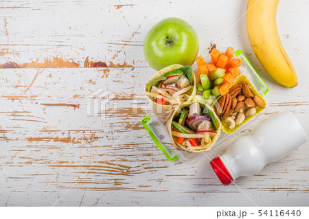 Lunch to go with tortilla wraps and vegetables 54116440