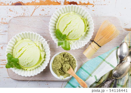 Matcha tea ice cream in white bowl 54116441