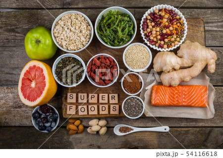Selection of superfoods on rustic background 54116618