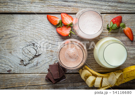 Selection of flavoured milk - strawberry, chocolate, banana 54116680
