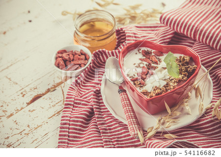 Valentine's day breakfast - granola with yogurt, goji berries and coconut Valentine's day breakfast - granola with yogurt, goji berries and coconut 54116682