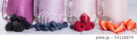 Selection of colorful detox berry drinks on wood background 54116874