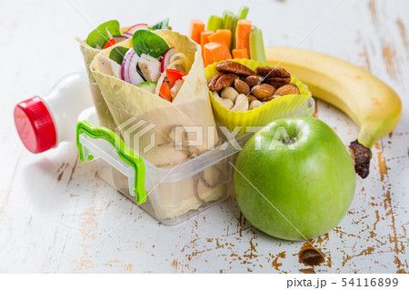 Lunch to go with tortilla wraps and vegetables 54116899
