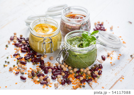 Selection of colorful hummus in jars Selection of colorful hummus in jars 54117088