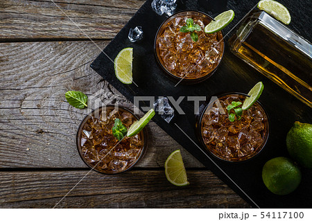 Rum and cola cocktail in glasses Rum and cola cocktail in glasses 54117100