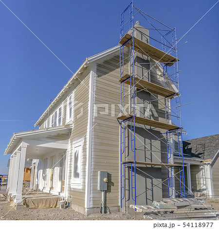 Scaffoldings and ladders on home construction site 54118977