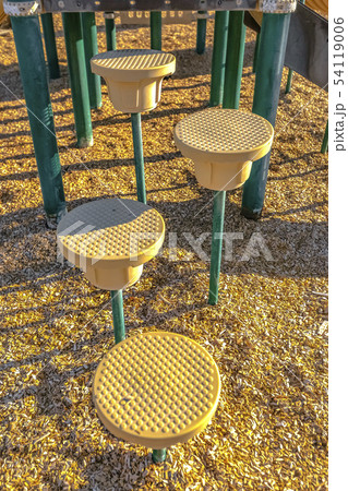 Round steps on poles of a playground 54119006