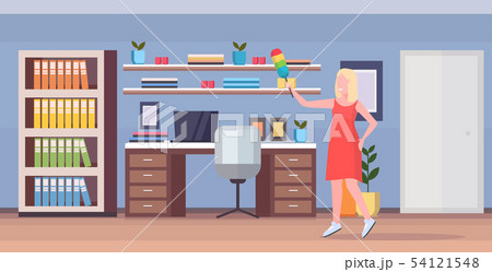 housewife holding dust brush woman cleaner doing housework dusting wooden shelf cleaning 54121548