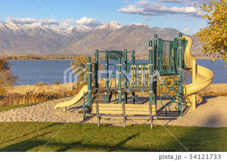 Playground in front of Utah Lake and Mountains 54121733