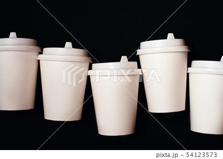 Five paper cups on black background 54123573